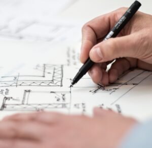 Someone drawing a BIM and MEP architectural design.